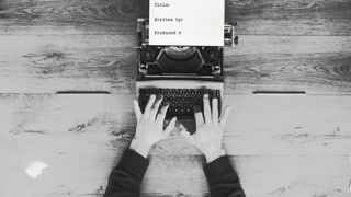 Black and white from above shot of hands typing on a vintage typewriter with a coffee next to it. Text: Title, written by, produced by. Film script, book or letter. More styles in the gallery