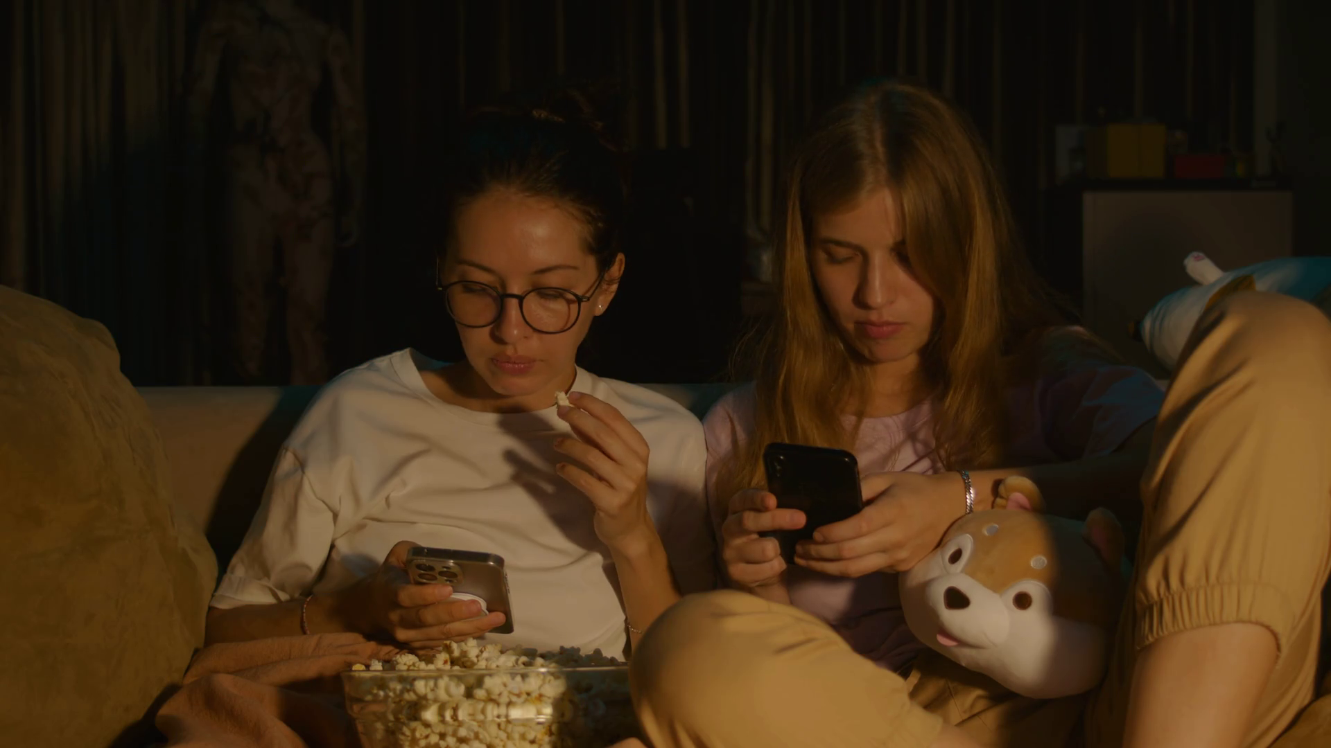 Two Girls Sitting On Cozy Sofa At Home Stock Footage SBV-348823857 ...
