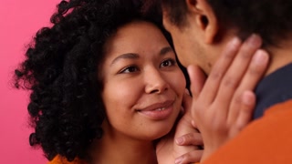 Close-up view of lovely man and woman kissing and hugging