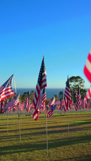 USA Flag Display at September 11 Memorial Tribute with Ocean View at Sunset.