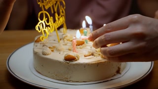 Happy girl on birthday party with family at home, Family celebrating child’s birthday with happiness