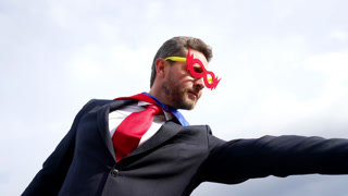 achievement and ambition of leader in hero mask, businessman