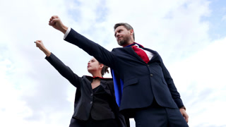 businesspeople in superhero suit good business partners on sky background, partnership