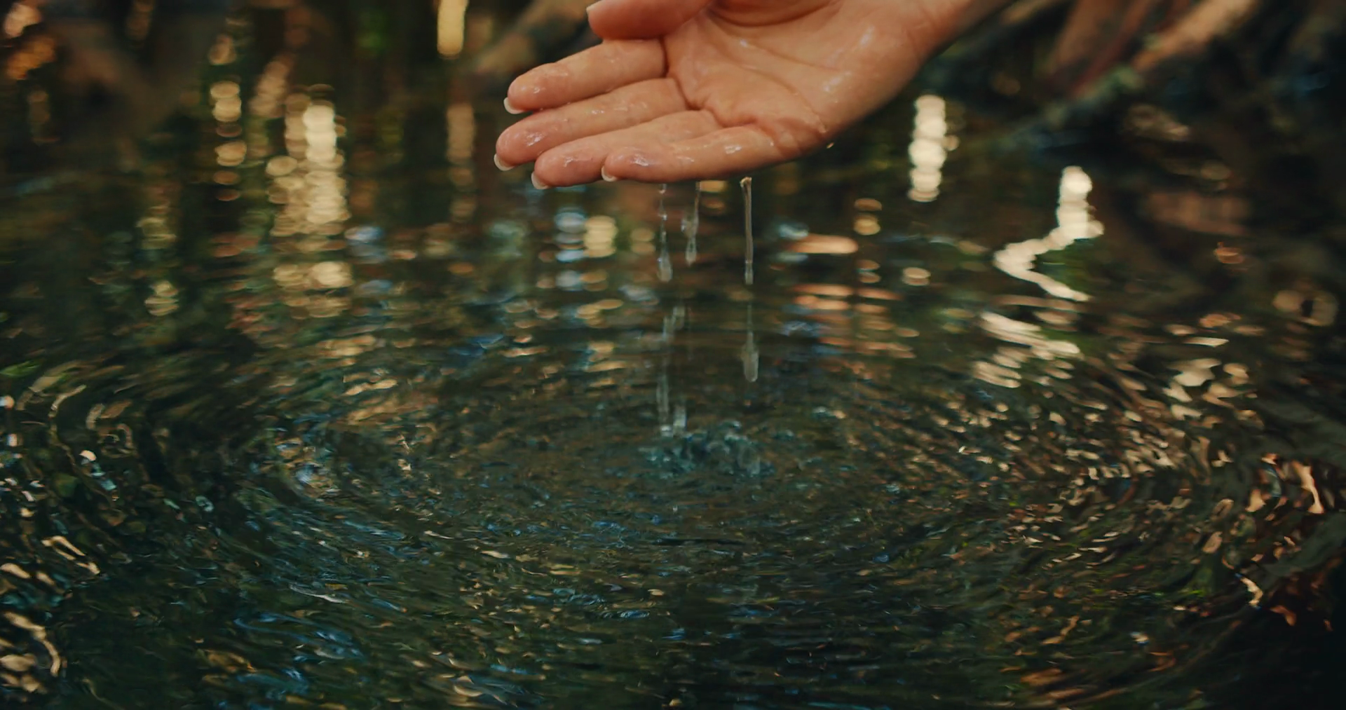 Hand Creating Ripples Touching Water In Stock Footage SBV-352361906 ...