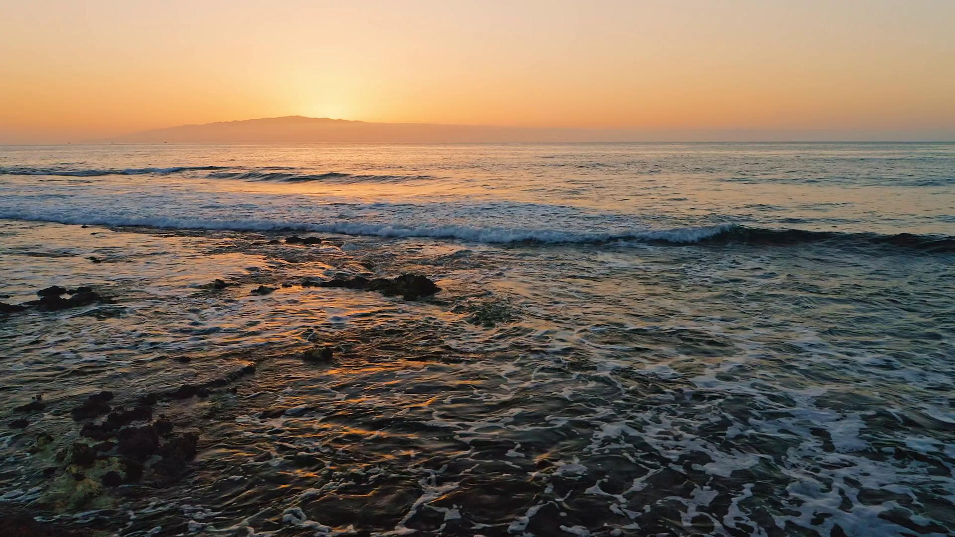 Beautiful mountain island sunset over the sea, solar golden path on the ...