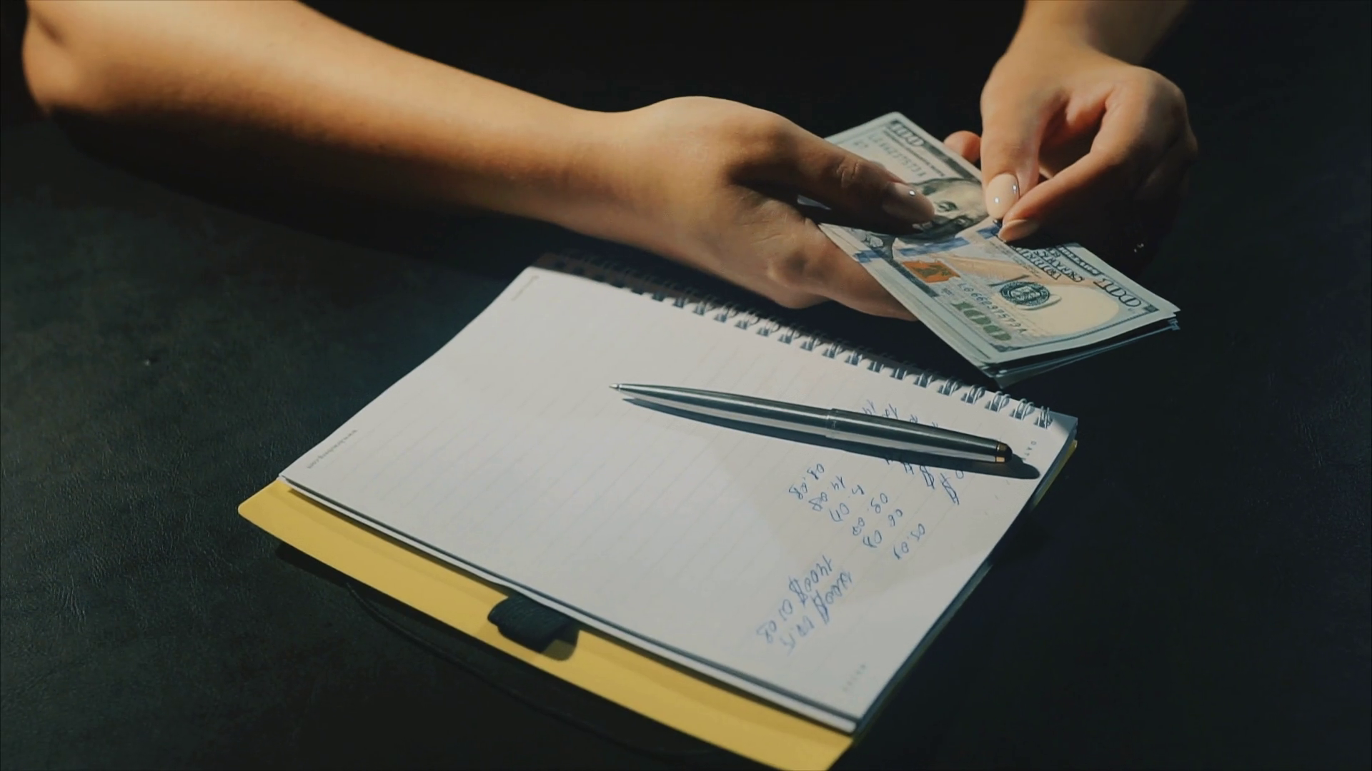 concept-of-family-budget-crisis-woman-hads-count-dollars-salary-and-write-wastes-stock-video