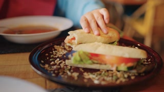 Woman enjoying a meal in a cafe: food, nutrition concept