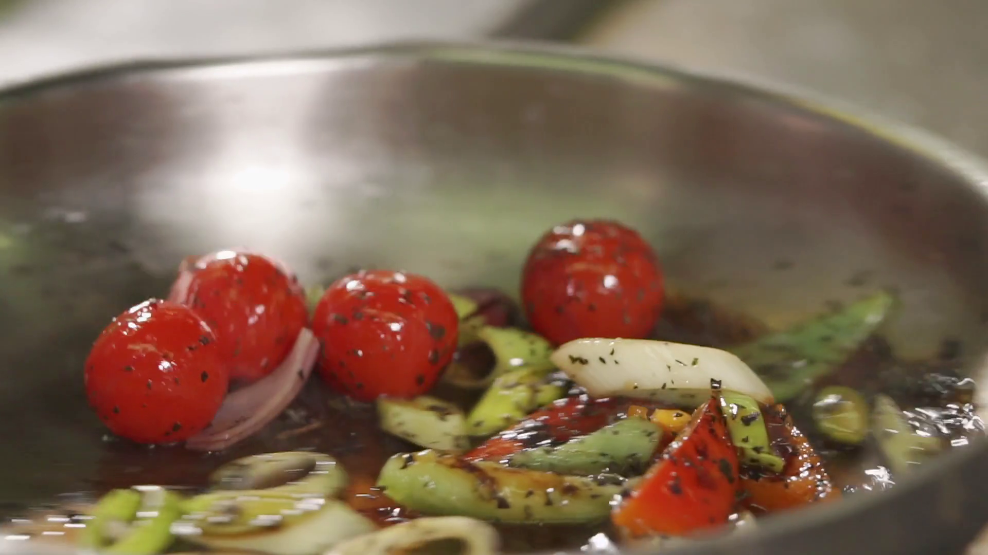 close up shot of a frying pan in which roasted in oil and spices