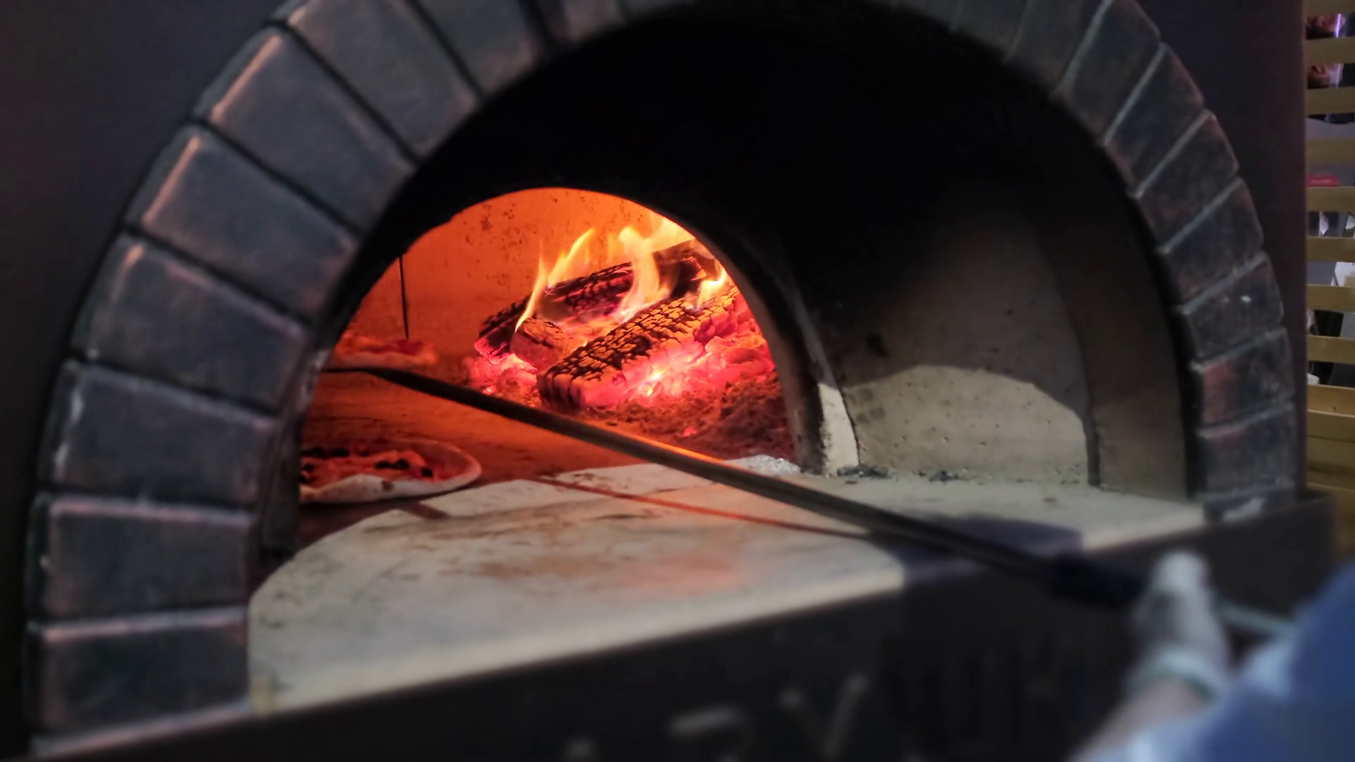 Cook Puts Raw Pizza Into Brick Oven In Stock Footage SBV338547811 Storyblocks
