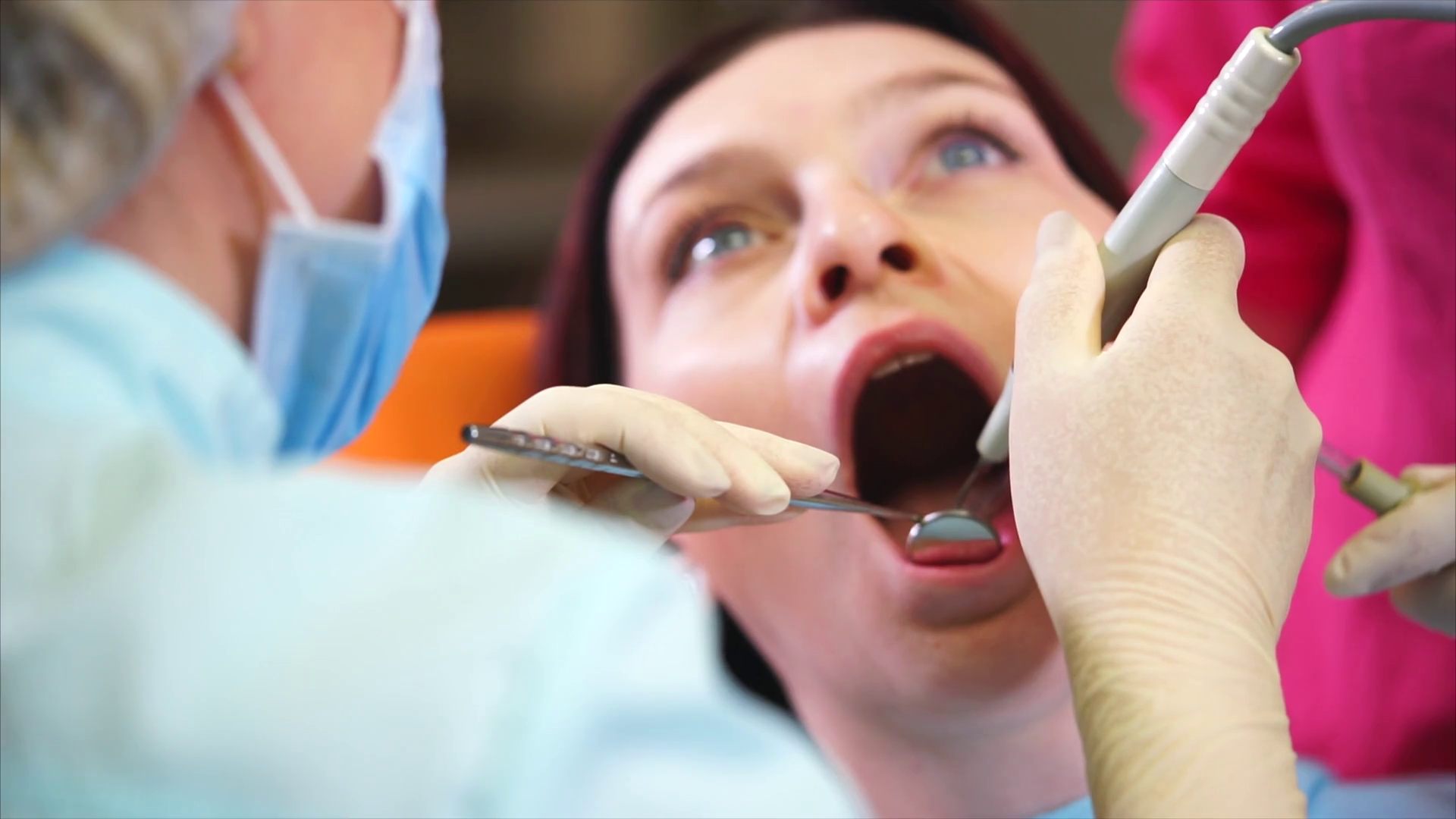 Procedure during the visit to dental clinic. Dentist using professional