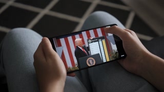 President Trump Trump Announces Tariffs In White House 2 April. Person Watches US President Donald Trump's Speech at White House on His Mobile Phone. Greer, SC, USA - August 03, 2025.