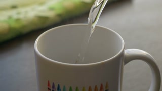 Fresh Morning Pour Over Coffee Close Up. Slow Motion. Milk Chocolate In White Cup. Pouring Hot Water From Kettle to Make Coffee Closeup. Pouring Hot Water Into White Cup Chocolate.