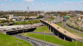 Washington DC city skyline with highway bridge and traffic