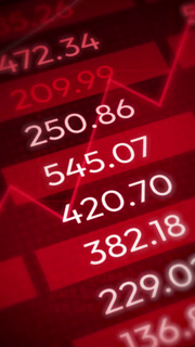 Red stock market ticker shows declining financial data graph