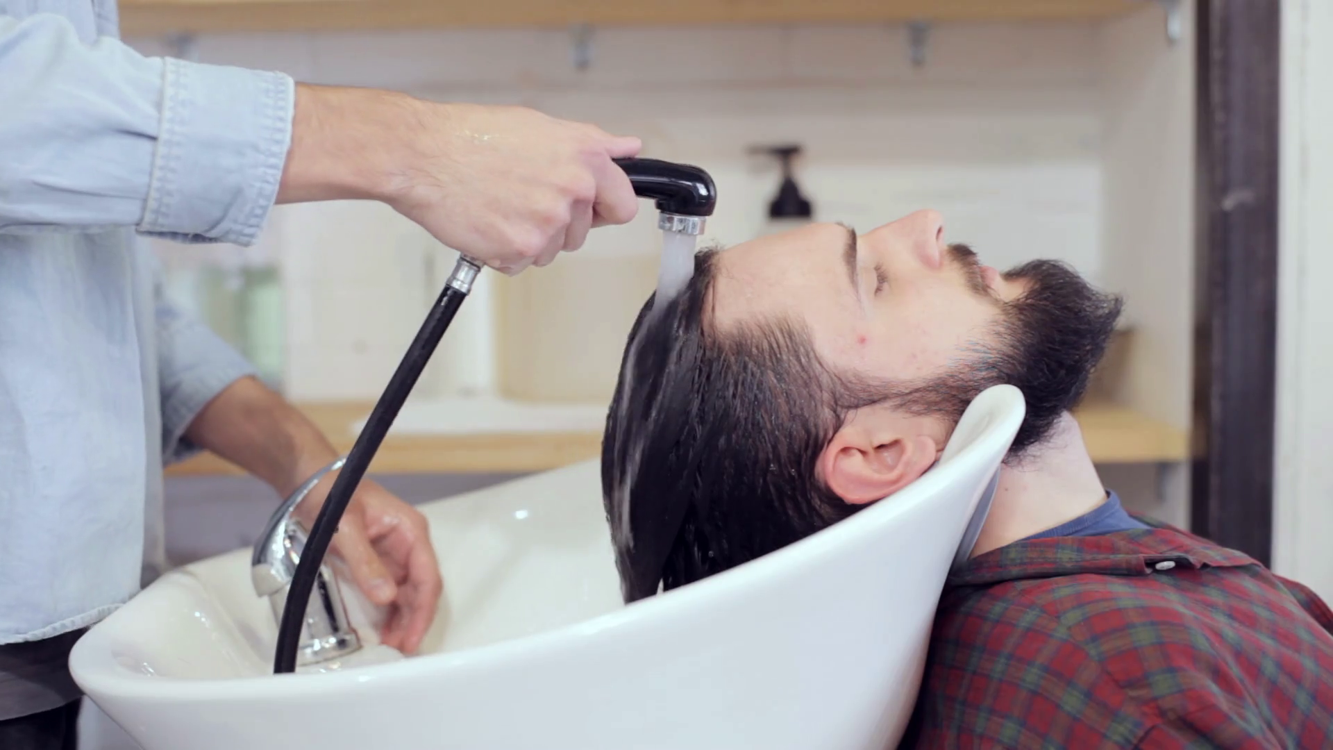 Man Barber Washing Male Hair At Stock Footage SBV310999721