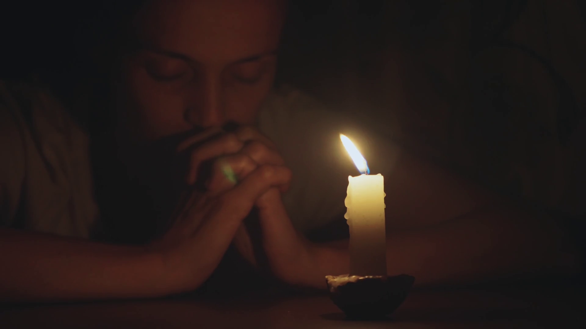 Woman Praying In Dark With Closed Eyes Stock Footage SBV338785983