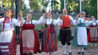 Helsinki, Finland - 21 June, 2024: Finnish folk dancers dancing during traditional midsummer celebration in Seurasaari open-air museum