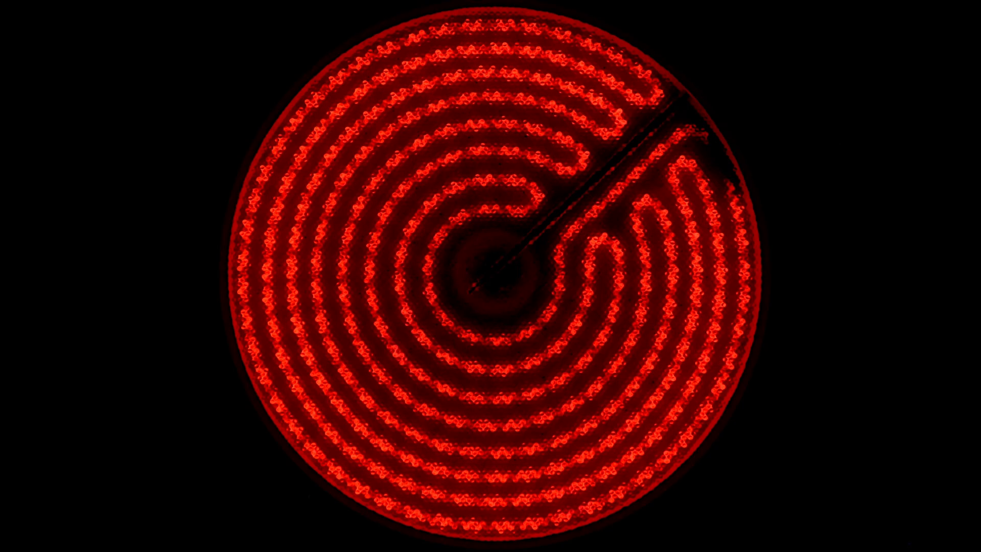 Infrared electric stove turns on, heats up to maximum and off. Close up