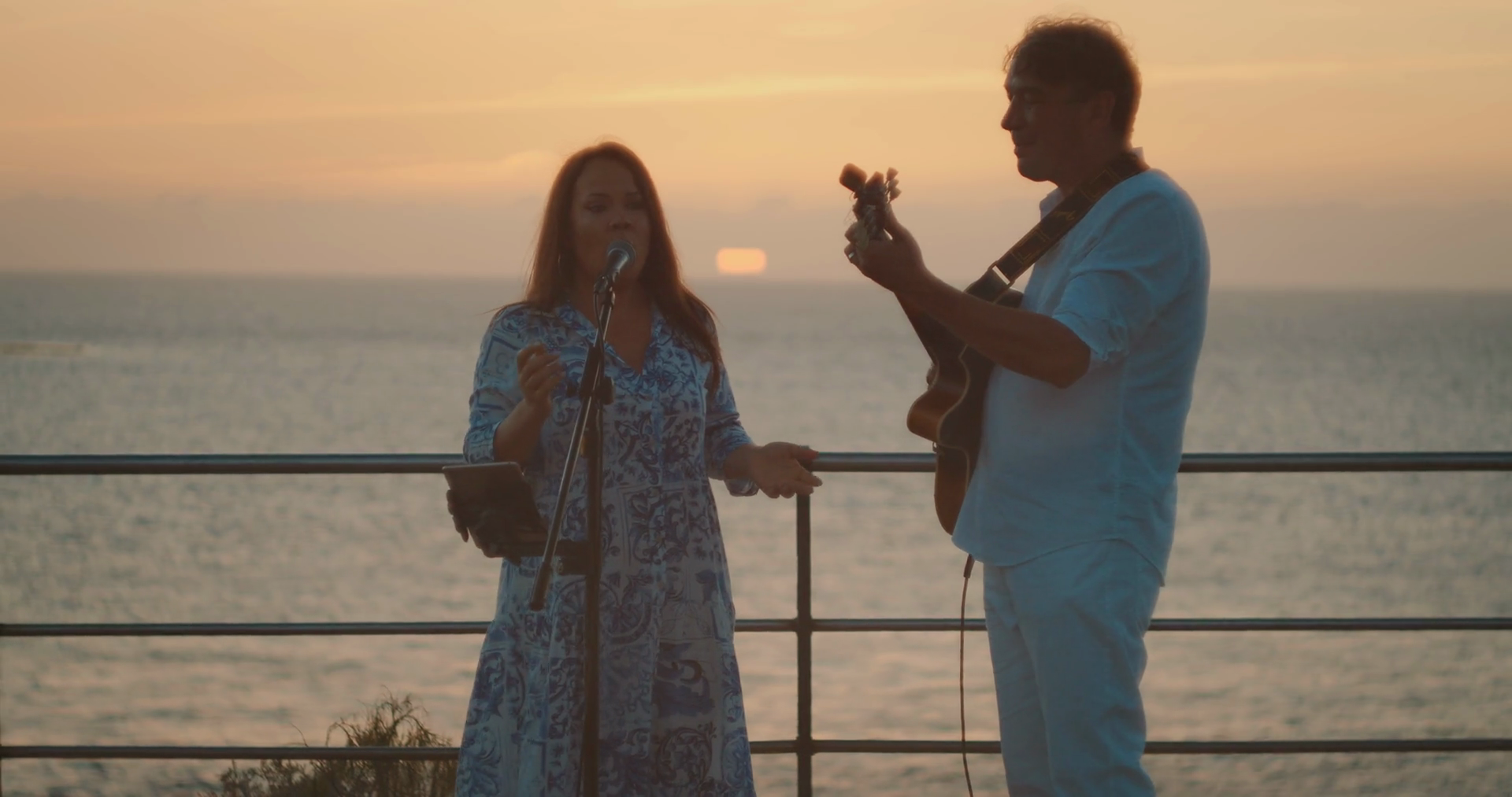 Musical Duo Performing Ocean During Colorful Stock Footage SBV ...