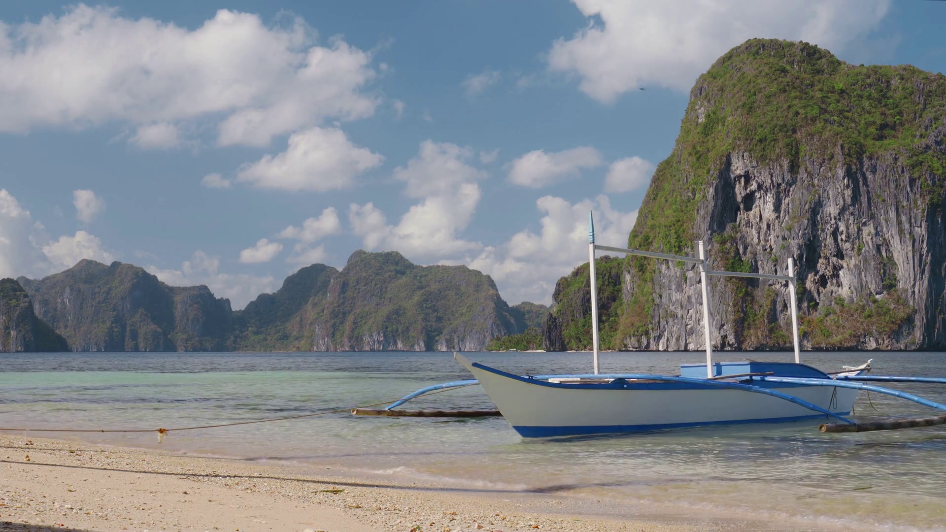 El Nido, Palawan, Philippines. Tropical scenery of banca boat on the sandy beach ready for