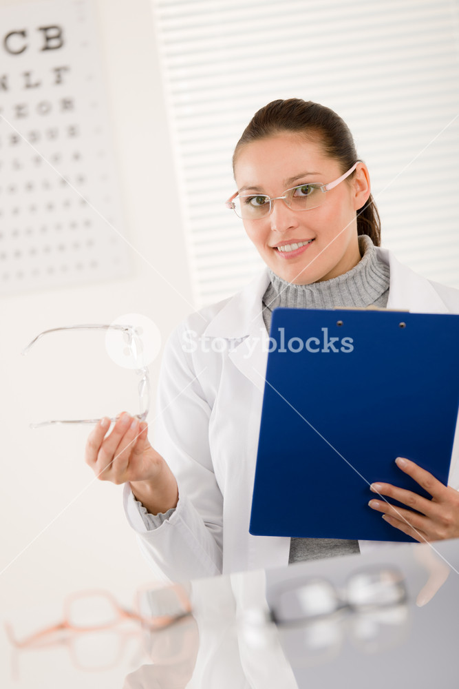 Optician doctor woman with prescription glasses and eye chart Royalty